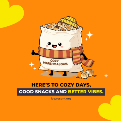 A cute marshmallow bag cartoon wears a hat and scarf, surrounded by marshmallows on an orange background. Text below says: Here’s to cozy days, good snacks and better vibes. b-present.org with yellow hearts in the corners.